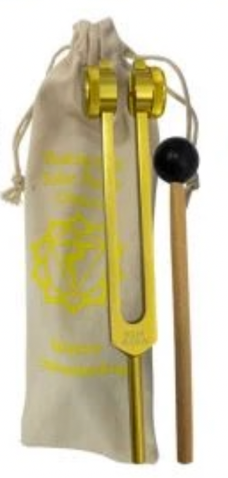 Gold tuning fork with black handle in a beige drawstring bag on a white background