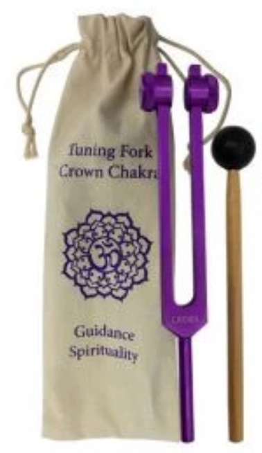 Tuning fork with purple handle and black weight, accompanied by a beige drawstring bag with text and symbols.