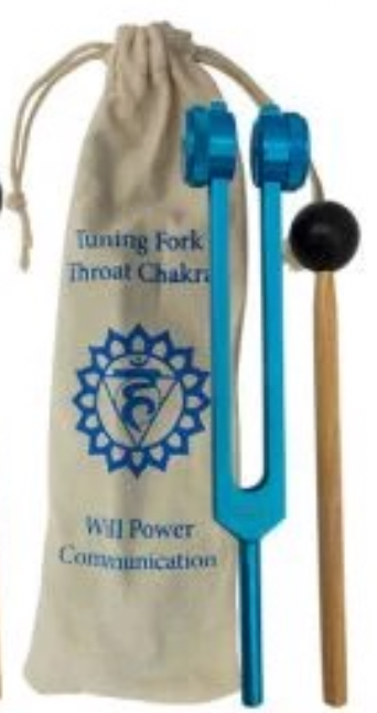 Tuning fork with blue handle and black ball, placed on a beige drawstring bag with text and symbols.