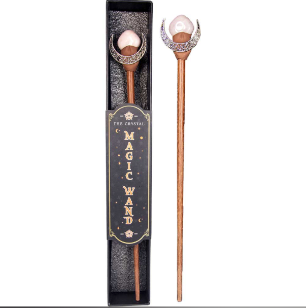 Decorative magic wand with decorative head and packaging on a white background