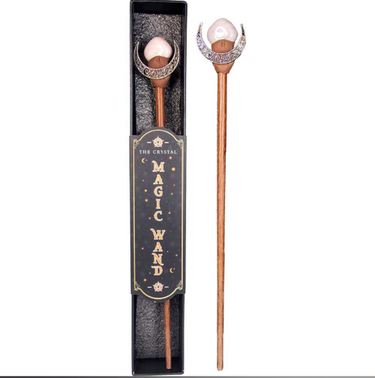 Decorative magic wand with decorative head and packaging on a white background