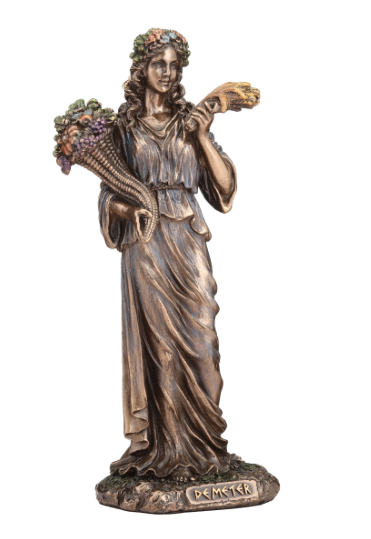 Bronze statue of a woman holding a snake and flowers on a white background