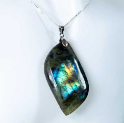 Labradorite pendant on a white background