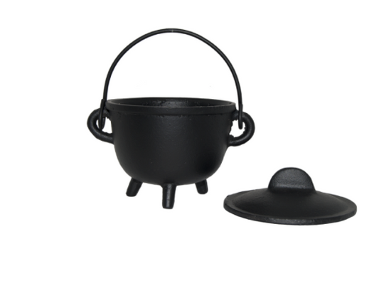 Black cast iron pot with lid on a white background