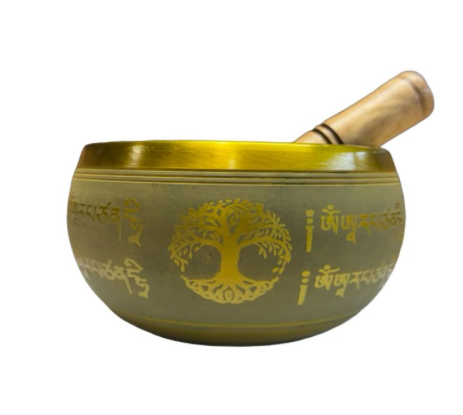A Tibetan singing bowl made of bronze with gold-colored engraved script and a tree of life design, accompanied by a wooden mallet on a plain white background.