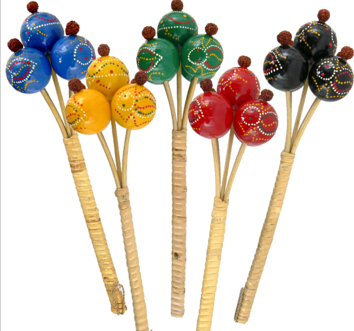 Four hand-painted wooden maracas with natural wood handles, shown against a plain white background. The maracas feature vibrant colors including blue, yellow, green, red, and black, with intricate white and brown dot patterns and small brown pom-poms on top.