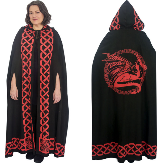 A black hooded cape with red Celtic knot trim and a large red dragon graphic on the back, shown on a model against a white background.