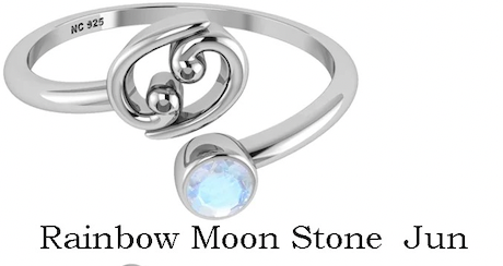 Silver ring with a rainbow moonstone on a white background