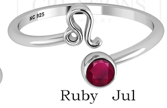 Silver ring with a red gemstone and 'NC 325' marking on a white background.