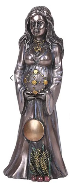 Statue of a woman holding a sphere with symbols, likely representing a deity or figure from mythology.