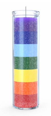 Colorful cylindrical candle with chakra colors layered inside a clear container.
