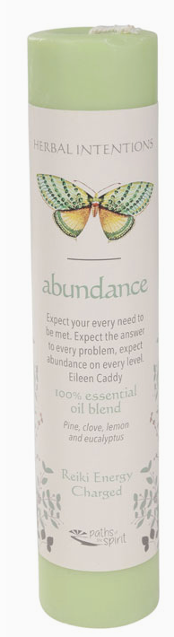 Herbal intentions candle labeled 'abundance' with a green butterfly design on a white background