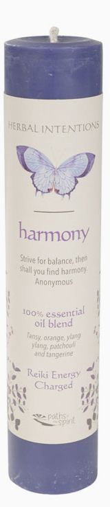 Candle with butterfly design and text on a white background