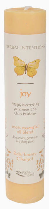 Candle labeled 'joy' with butterfly illustration on a white background
