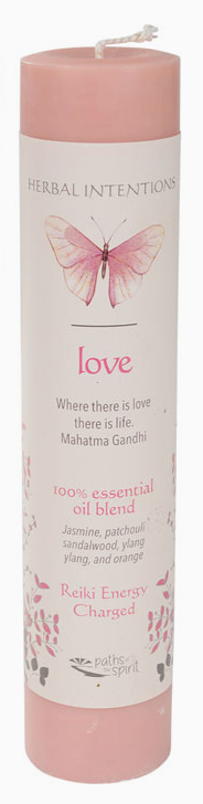 Pink candle with butterfly design and text on a white background