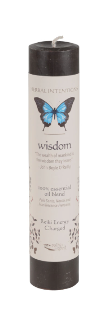 Candle with a butterfly design on the label against a white background