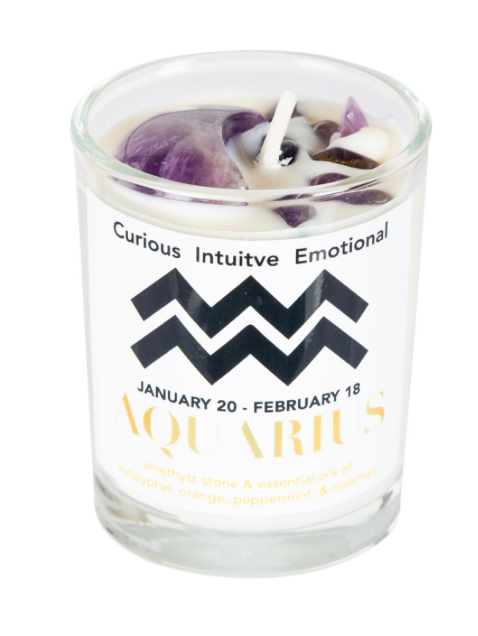 Candle in a glass jar with an Aquarius zodiac label on a white background