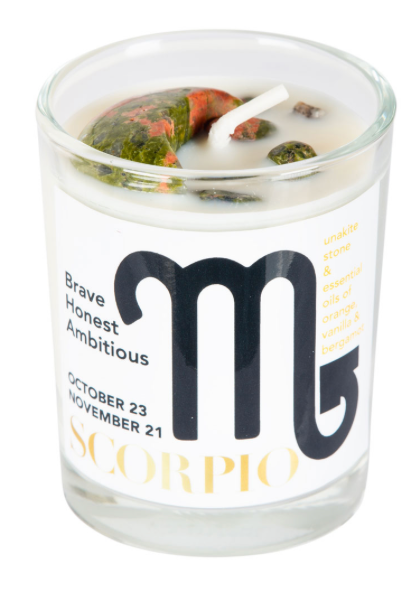 Scorpio zodiac candle in a glass jar with a label on a white background
