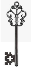 An ornate decorative key-shaped wall hanging or ornament in a dark metallic finish, shown against a plain white background.