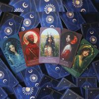 Collection of tarot cards with celestial designs on a blue background