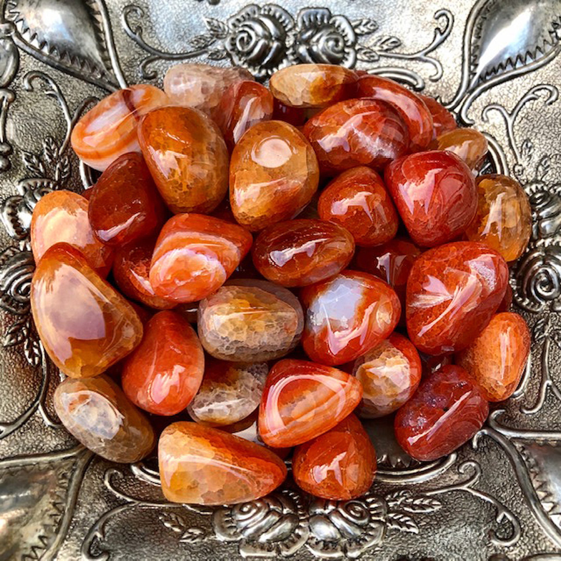 Red, orange, and yellow semi-translucent stone with quartz spots