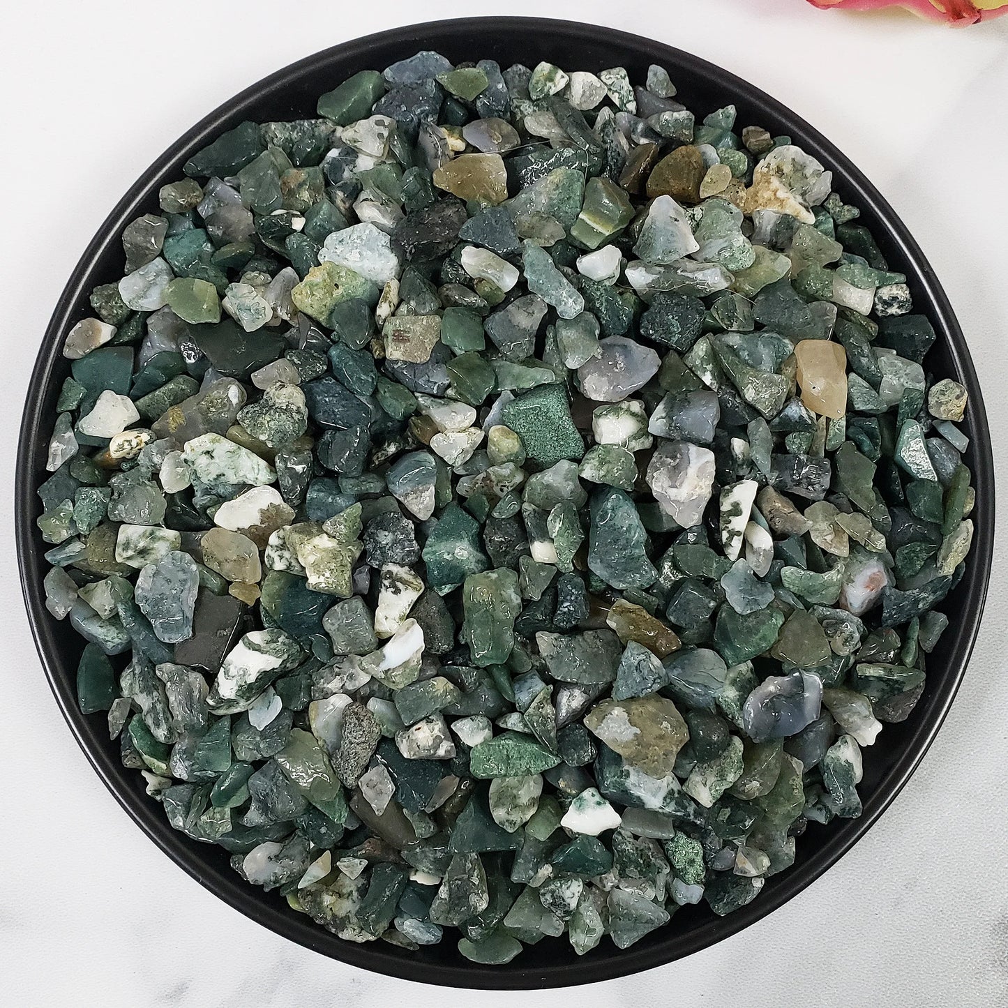 small chips and green, white, and milky blue stones