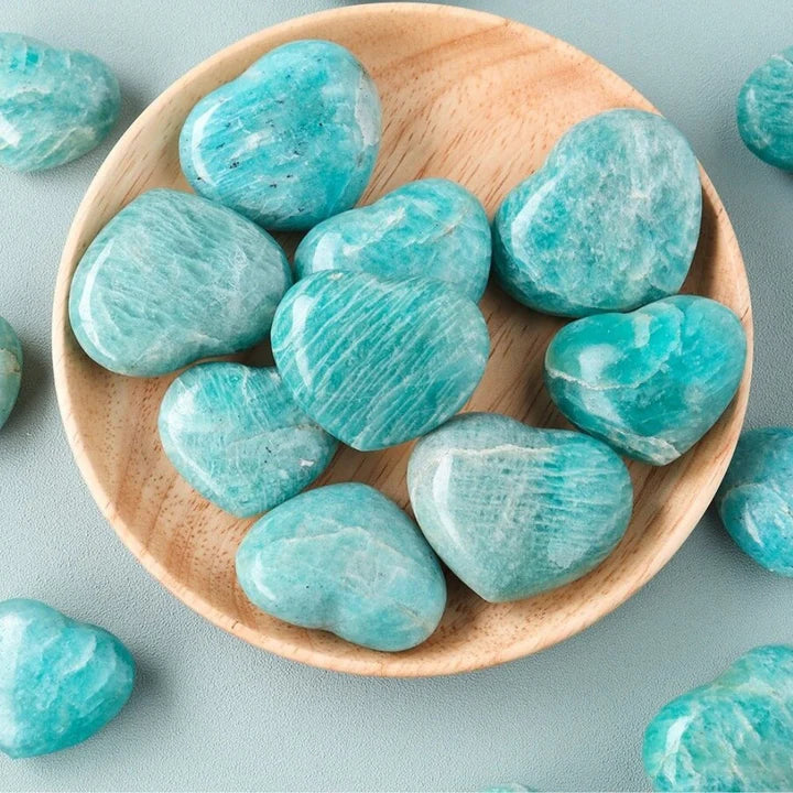 greenish blue heart shaped polished stones with white inclusions