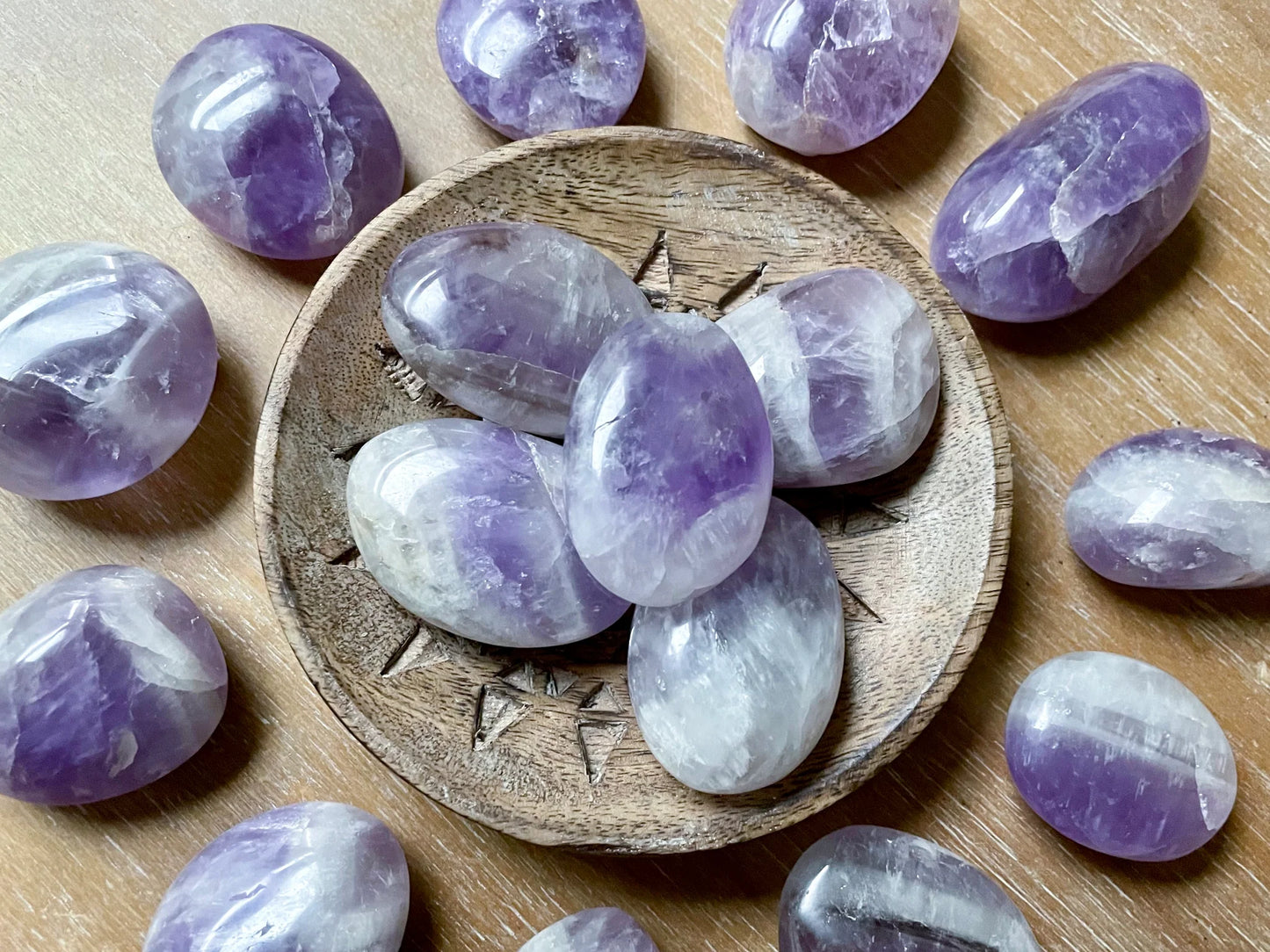 various shades of purple amethyst in polished palm sized stones