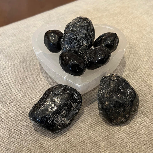 large pieces of dark grey glassy stones