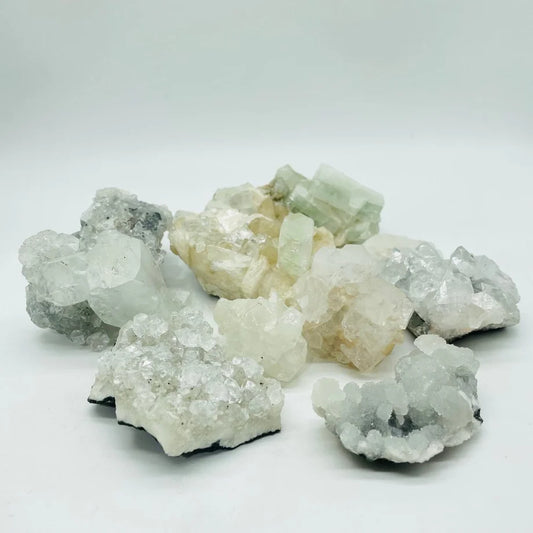 raw, rough, semi translucent stones, usually forming pyramids, in varying shades of clear, white, yellow, and green.