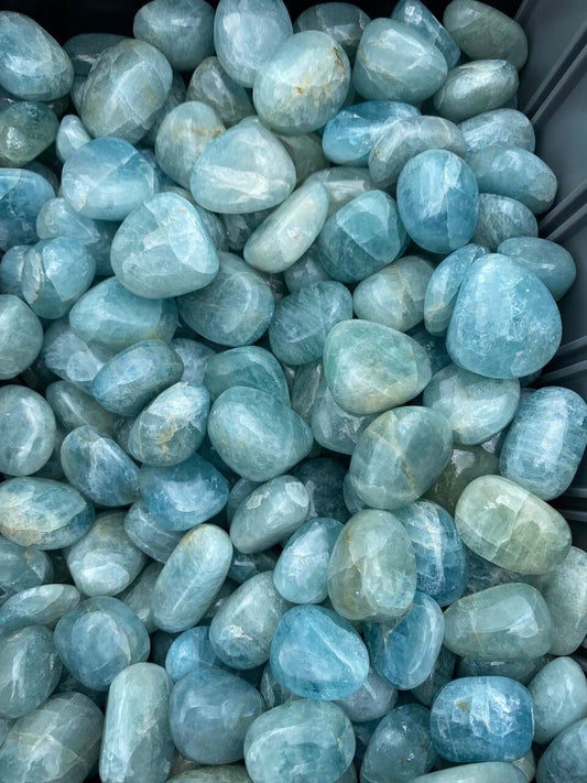 polished crystalline tumbled stones in shades of greenish blue