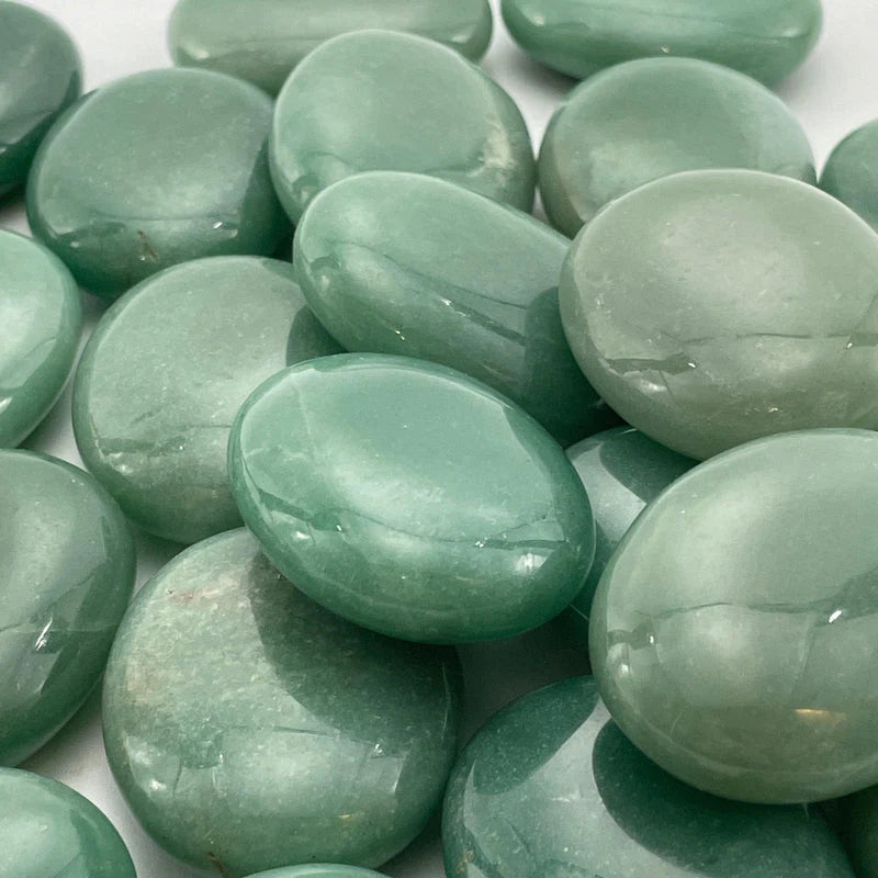 semi-translucent green palm sized stones with darker green flecks