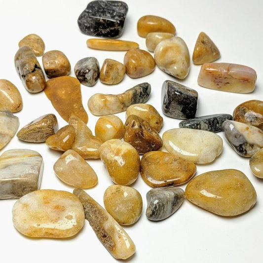 yellow, orange and brown tumbled stones in various shapes and sizes