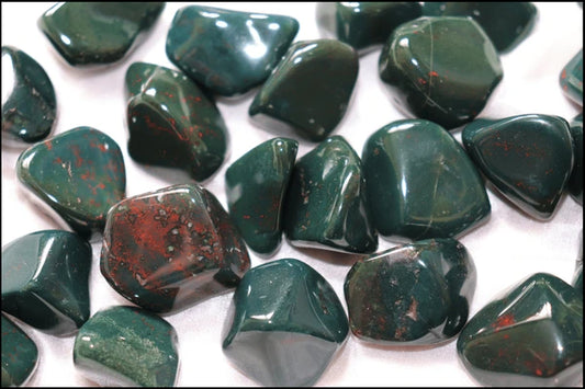 smooth, tumbled, dark green stones with red spots