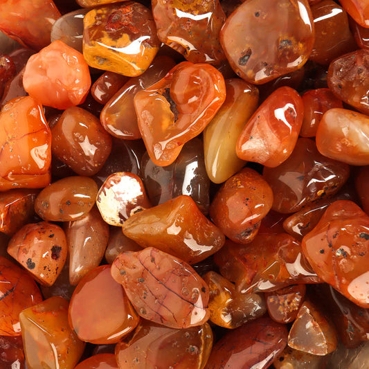 Medium sized, smooth, tumbled, semi-translucent, orange, brown, and red, stones with a shiny finish