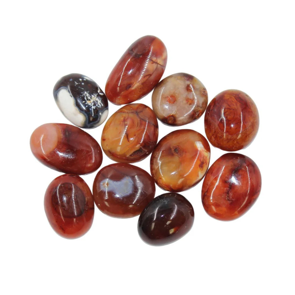 Smooth, polished, palm sized stones in shades of brown, red, white and orange