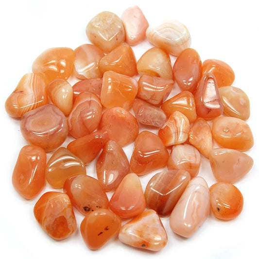 Smooth, tumbled, small sized stones, semi-translucent with a shiny finish, in shades of orange and white