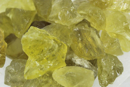 Small yellowish green semi-translucent raw stones.