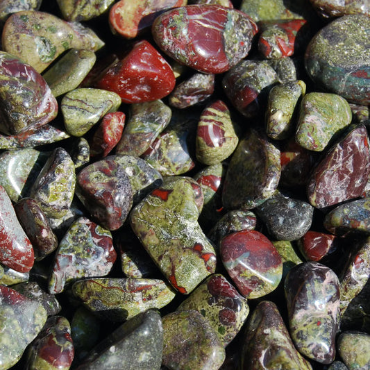 Smooth, tumbled, freeform, dark green stone with red veins