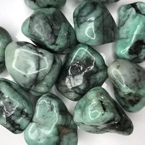 free form rough but tumbled stones in varying shades of grey, green, and turquoise