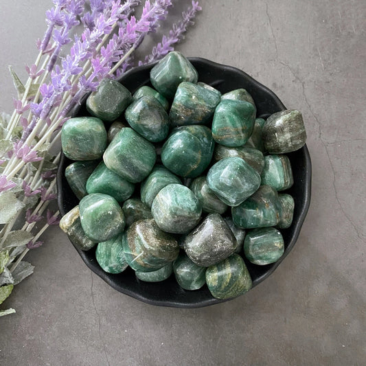 rectangular tumbled stones in varying shades of grey, green, and turquoise