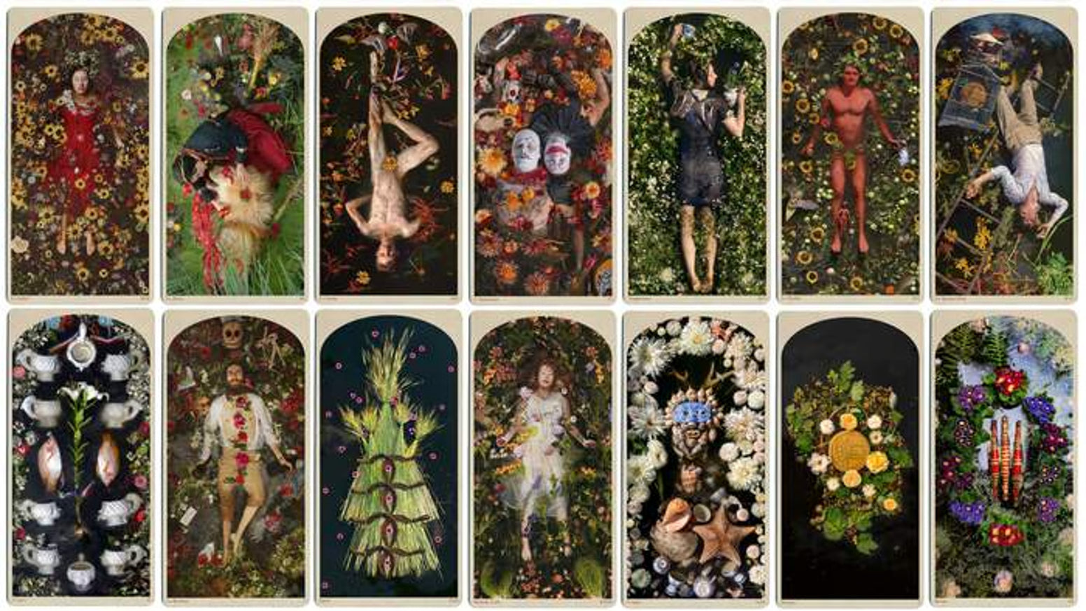 Collection of tarot cards with various artistic designs and figures.
