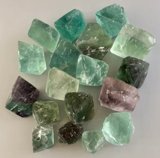 octahedron of green and purple semi translucent stones around 1 inch