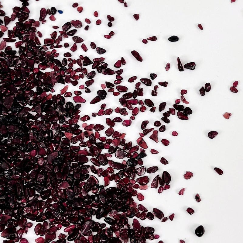 tiny tumbled chips of dark red and purple stones