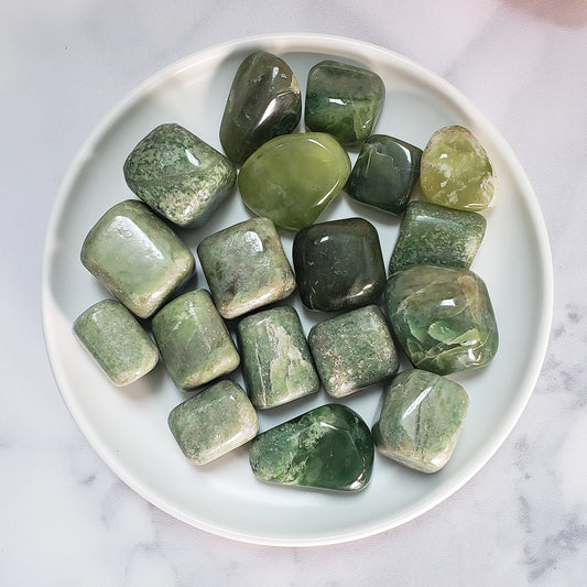 Tumbled, polished, green stones with a smooth crackled finish, in varying shades and sizes