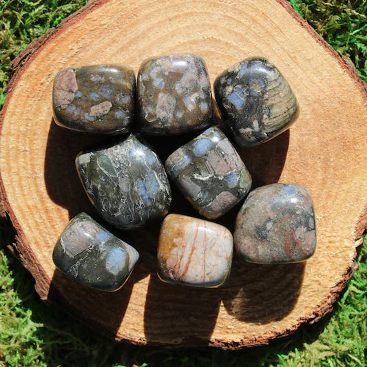 tumbled smooth rectangular grey and brown stones with spots of pink, purple, blue, tan, and orange