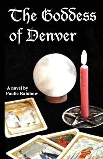 black book cover with candle, crystal ball, and tarot cards