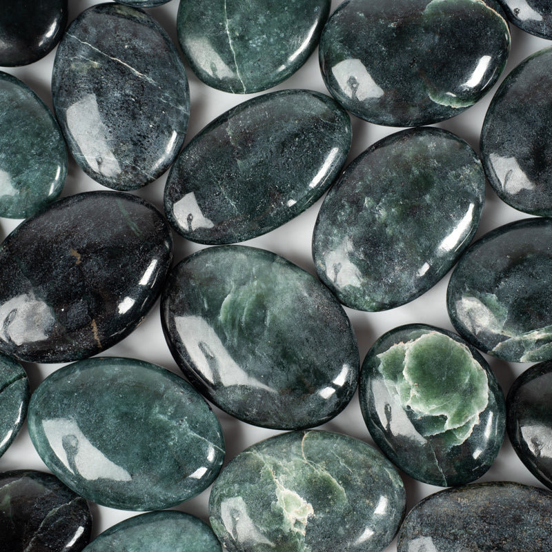 dark green palm shaped smooth stones with lighter green crackled inclusions