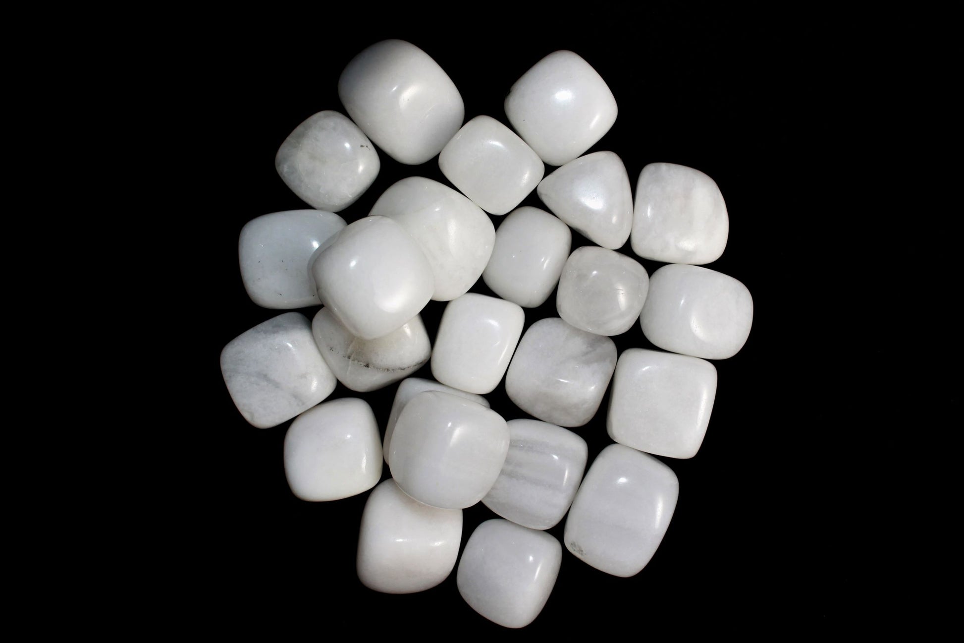 smooth, tumbled, banded, white and cream coloured stones