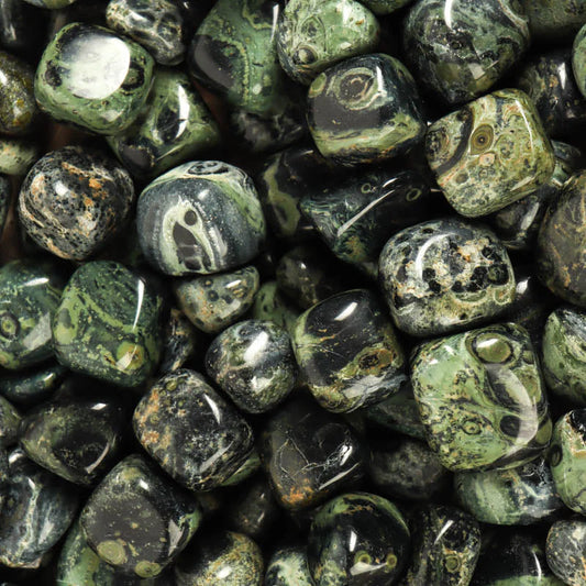 tumbled, smooth, stones with orb patterns of black and dark green